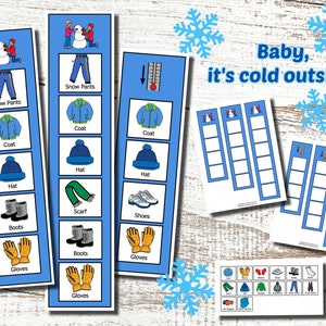 May include: Educational winter-themed flashcards with illustrations of clothing items like snow pants, coats, hats, boots, and gloves. The phrase "Baby, it's cold outside!" is displayed. The cards are designed with a blue border and white background.
