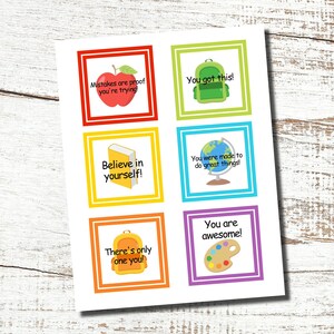 May include: A sheet of colorful square cards with motivational phrases and illustrations. The cards feature an apple, backpack, book, globe, palette, and backpack. Phrases include "Mistakes are proof you're trying!" and "You are awesome!"