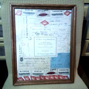 Framed pharmacy memorabilia dr. scripts, medication labels, checks 1925-1936