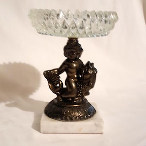 Italian heavy diamond cut glass vanity dish bronze pedestal cherub riding fish sculpture on marble base bath vanity accessory midcentury