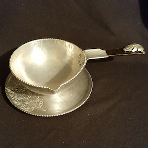 Vintage hand wrought hammered aluminum metal handled gravy boat bowl with drip dish dining serving utensil continental chrysanthemum design