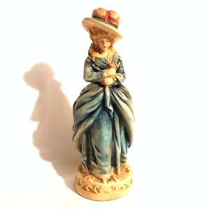 Vintage excellent 10.5&quot; victorian chalkware lady woman figure figurine statue holding pink flower flowing blue dress hat feather plumes