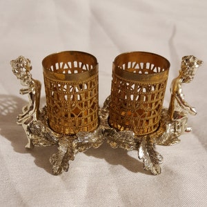 MCM Designer Sam Fick signed gold metal footed cherub figurine leaf accented 2 tube filigree lipstick holder tray vanity accessory storage