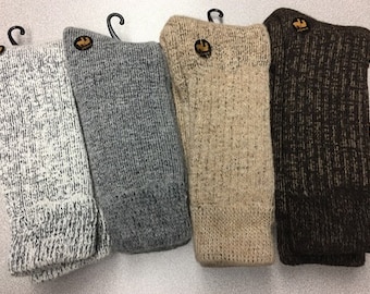 May include: Four pairs of knitted socks in different colors: white with black flecks, gray, beige, and brown with gold flecks.