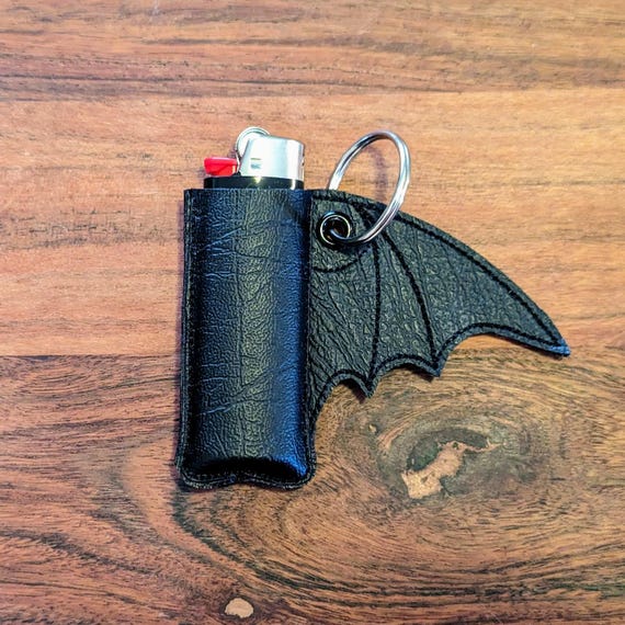 champagne cigarette holder An unusual pipe/cigarette holder in the form of a champagne bottle, with cigarette  lighter inside, i