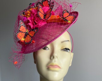 Diadema fascinadora Hat Disc rosa y naranja con mariposas y redes