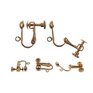 May include: Gold-tone metal earring clips with a screw-on back. The clips are designed to hold earrings in place for those with sensitive ears.