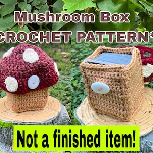 Puede incluir: Patrón de caja de setas de ganchillo. La imagen muestra una caja con forma de seta con un sombrero rojo y blanco, un tallo marrón y un botón blanco. El texto dice "Mushroom Box *CROCHET PATTERN*" y "Not a finished item!"