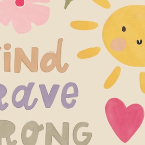 May include: A whimsical illustration featuring a smiling yellow sun, pink flowers, and a pink heart. The words "KIND", "BRAVE", and "STRONG" are written in a playful font, set against a cream-colored background.