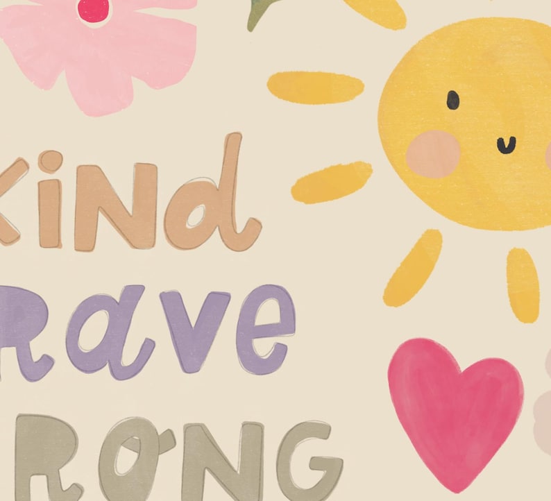 May include: A whimsical illustration featuring a smiling yellow sun, pink flowers, and a pink heart. The words "KIND", "BRAVE", and "STRONG" are written in a playful font, set against a cream-colored background.