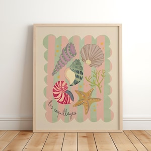 May include: Framed art print with illustrations of seashells, a starfish, and coral on a pink and green striped background. The French text "les coquillages" is included. The artwork is presented in a light wood frame.