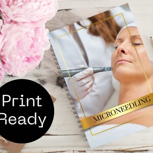 May include: A white and gold notebook with a photo of a person receiving a microneedling treatment. The notebook has the text "MICRONEEDLING" on the cover.