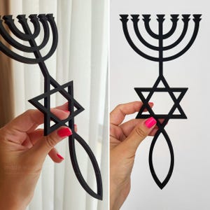 May include: Black wooden menorah with a Star of David and a fish-like shape at the bottom. The menorah has nine candle holders. The image is of a religious symbol.