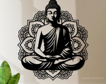 May include: Black and white silhouette of a meditating Buddha figure sitting in a lotus position, surrounded by a mandala design.