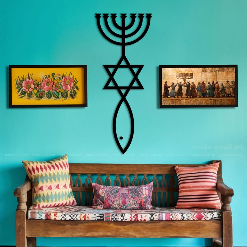 May include: A wooden bench with patterned cushions and pillows sits below a turquoise wall adorned with framed artwork and a black metal wall sculpture. The sculpture combines a menorah, Star of David, and fish symbol.