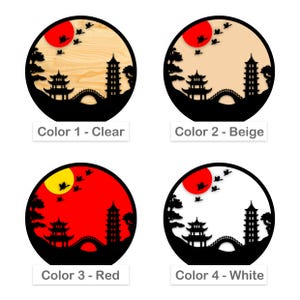 May include: Four variations of a wall decor design featuring a black silhouette of a Japanese pagoda, bridge, and trees against a circular background. The background colors are clear, beige, red, and white.