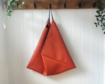 Orange Tiny Waffle Textured Vegan Leather Origami Bag with Faux Suede Strap and Charm