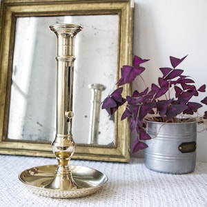 Old large solid brass candle holder with pusher