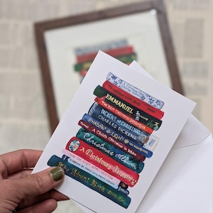 May include: A stack of illustrated books with Christmas themes, including "A Child's Christmas in Wales", "A Christmas Treasury", "Twas The Night Before Christmas", and "The Advent Book".