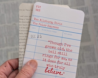 May include: A white rectangular library checkout card with rounded corners featuring red text that reads Van Allsburg, Chris, The Polar Express, and the quote, Though I've grown old, the bell still rings for me, as it does for all who truly believe.