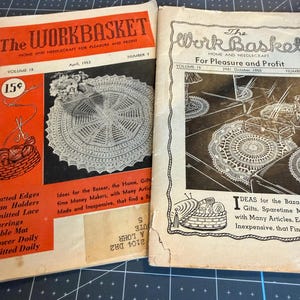 May include: Two vintage issues of The Workbasket magazine, one dated April 1953 with an orange cover and one dated October 1950 with a cream cover. Both magazines feature black and white illustrations of crocheted doilies and craft supplies.