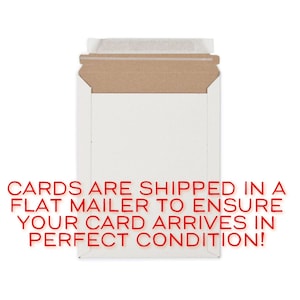 May include: A white envelope with a brown cardboard flap. The text "CARDS ARE SHIPPED IN A FLAT MAILER TO ENSURE YOUR CARD ARRIVES IN PERFECT CONDITION!" is printed in red on the envelope.