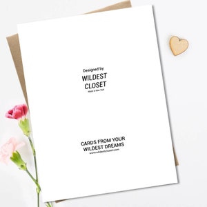 May include: White card with black text. The text reads "Designed by WILDEST CLOSET Made in New York" and "CARDS FROM YOUR WILDEST DREAMS www.wildestcloset.com"