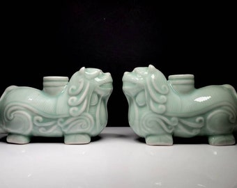 Pair of Chinese Resting Lion Figural Pottery Vessels in a Celadon Glaze, 6&quot;L
