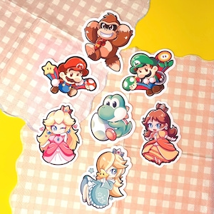 Super frères || Stickers Mario Bros. || Stickers vinyles mats || Grands frères || Stickers princesse || Dino vert || Tomes 1 + 2 ||