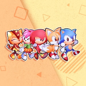 May include: Five cartoon characters from the Sonic the Hedgehog franchise. The characters are Sonic, Tails, Knuckles, Amy Rose, and a yellow character with a red tail. The characters are all smiling and looking at the viewer. They are standing on a yellow and orange background with geometric shapes.