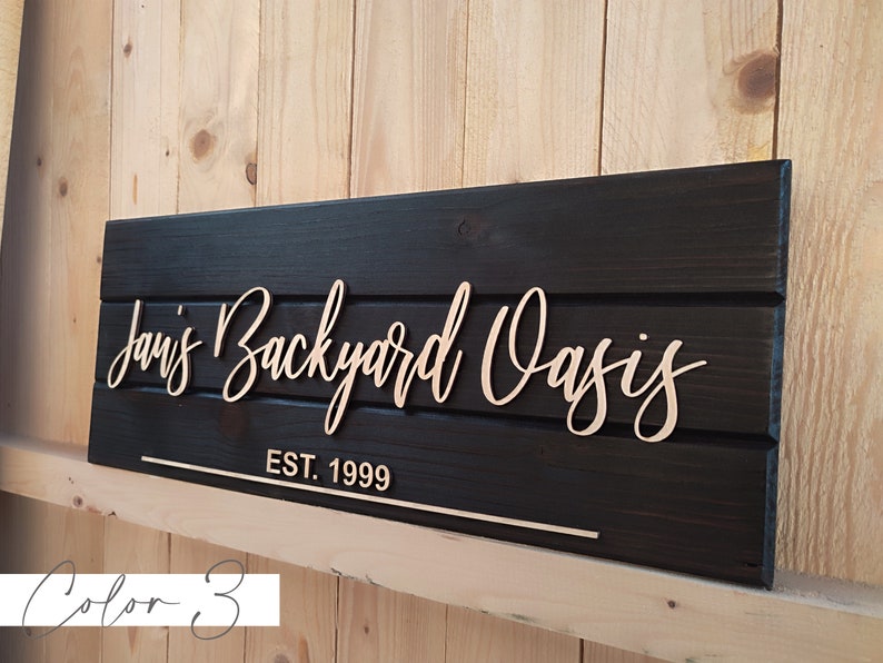 Personalized backyard oasis sign featuring custom text and a welcoming design, perfect for creating a cozy backyard retreat. A thoughtful housewarming gift for him and her.