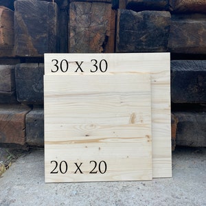 May include: Two wooden boards, one measuring 30 x 30 inches and the other 20 x 20 inches. The boards are light brown and have a natural wood grain.