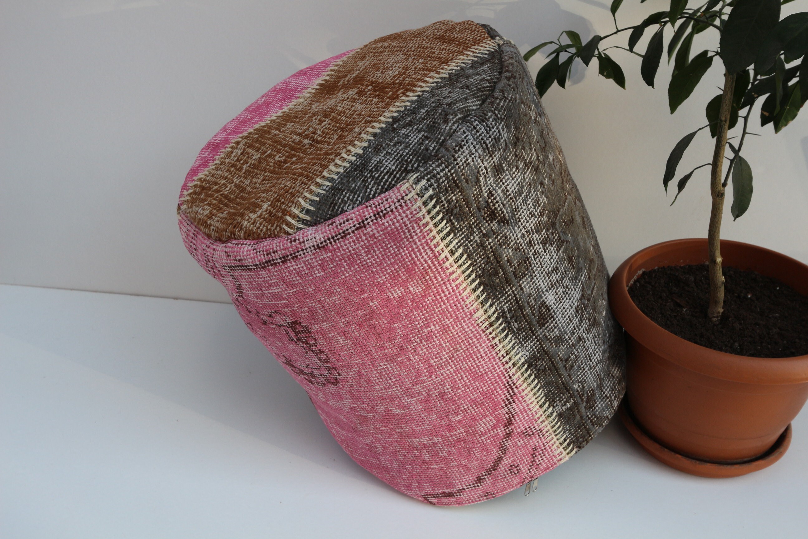 pink and grey pouffe