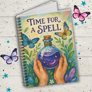 May include: Spiral-bound notebook with a colorful cover featuring the text "Time for a Spell." The cover art includes a potion bottle, butterflies, and floral elements. The notebook is decorated with additional butterfly and star illustrations.