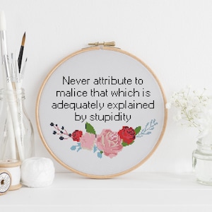 Never attribute to malice that which is adequately explained by stupidity counted cross stitch xstitch funny Insult pattern pdf image 1