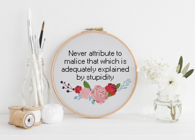 Never attribute to malice that which is adequately explained by stupidity counted cross stitch xstitch funny Insult pattern pdf image 1
