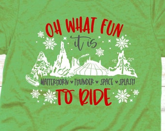 May include: Green t-shirt with white text that reads "Oh what fun it is to ride" with a white illustration of a winter wonderland scene and the words "Matterhorn, Thunder, Space, Splash".