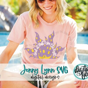 May include: A pink t-shirt with a purple sun design and the text "And at last I see the light".
