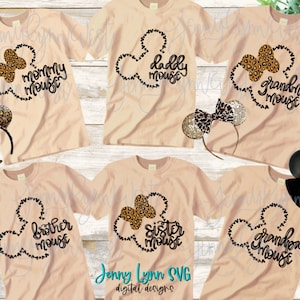 May include: Six beige t-shirts with black Mickey Mouse ears and leopard print accents. The shirts have the text "mommy mouse", "daddy mouse", "grandma mouse", "brother mouse", "sister mouse", and "grandpa mouse" printed on them.