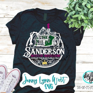 May include: A dark blue t-shirt with a white graphic of the Sanderson Witch Museum in Salem, Massachusetts. The graphic includes a black and white illustration of the museum building, a witch's hat, and the text "Sanderson Witch Museum, Home of the Black Flame Candle, Est. 1963, Salem, Massachusetts". The t-shirt also has the text "Jenny Lynn West SVG" in white.