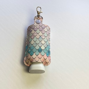 Mermaid travel lotion holder, hand lotion keeper, keychain or bag clip-on, lotion case.  Lotion not included