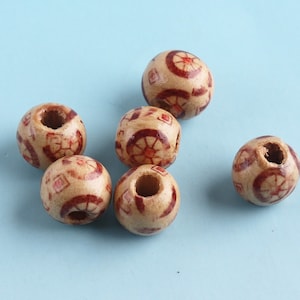 Perline di legno 50pcs 10mm perline rotonde in legno con foro Bottoni Boho Tappo Buffle cappotti Cord