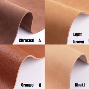 May include: Four leather swatches in different colors: charcoal, light brown, orange, and khaki. The swatches are labeled with the color name and a letter.