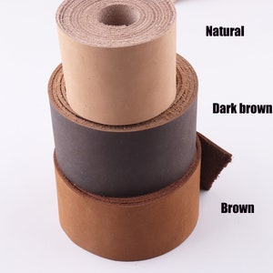 May include: Three rolls of leather straps in different colours: natural, dark brown, and brown.