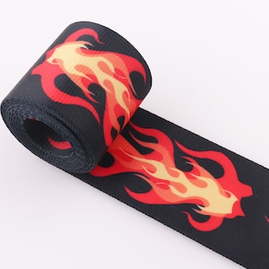 May include: Black webbing with a red and yellow flame design.