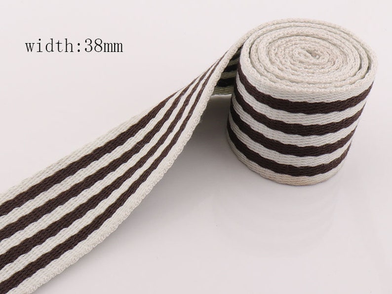 May include: Brown and white striped cotton webbing, 38mm wide.