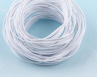 May include: A coil of white elastic cord against a light blue background. The cord is tightly wound, creating a circular shape. The material appears smooth and flexible, suitable for various crafting or sewing projects.