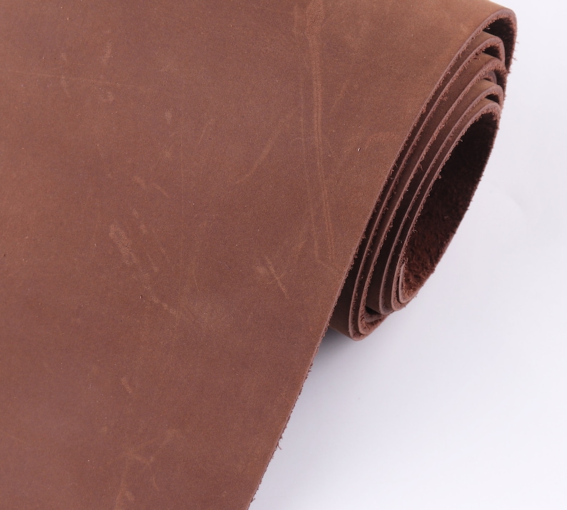 May include: A roll of brown leather, showing the texture and grain of the material.