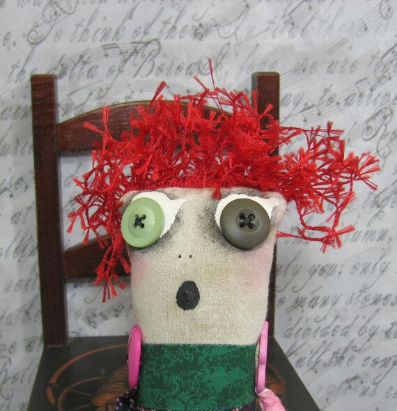 doll with pink hair and button eyes