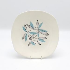 Ett vintage 12,5 cm midvinter Kassandra kaffefat av Jessie Tait, 1950-talet
